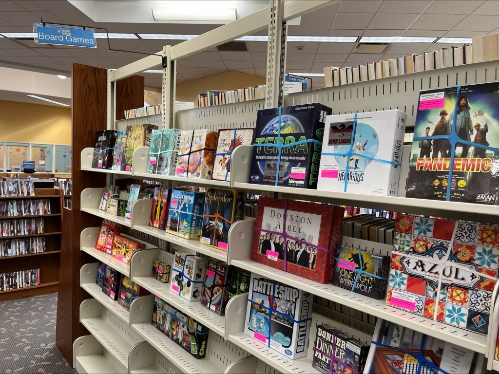 A picture of our board game shelves