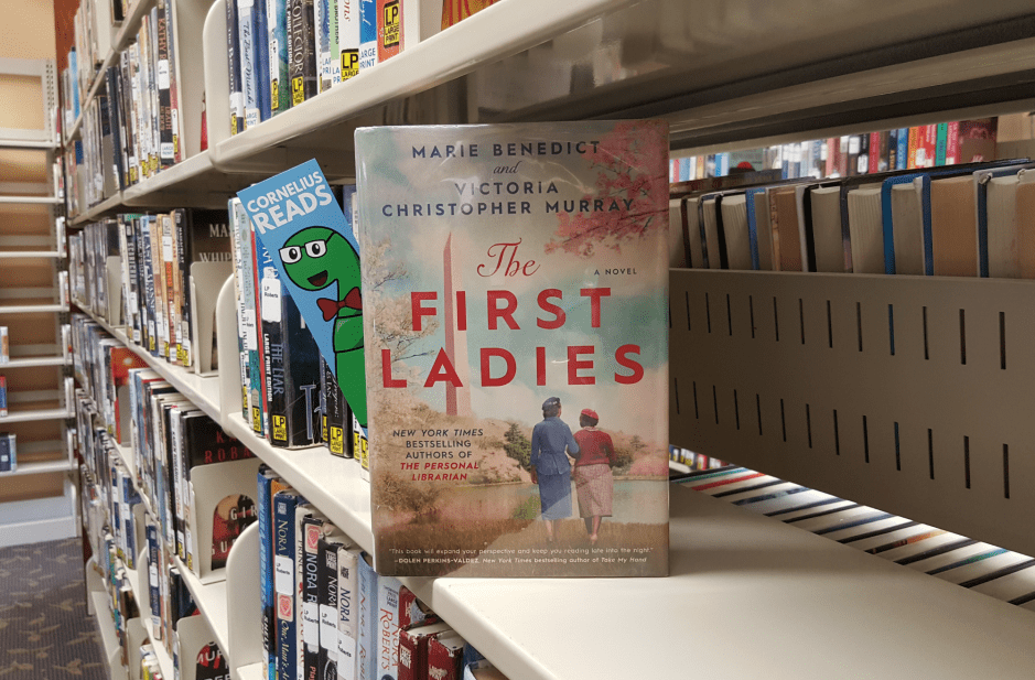 book titled, First Ladies, on bookshelf, facing